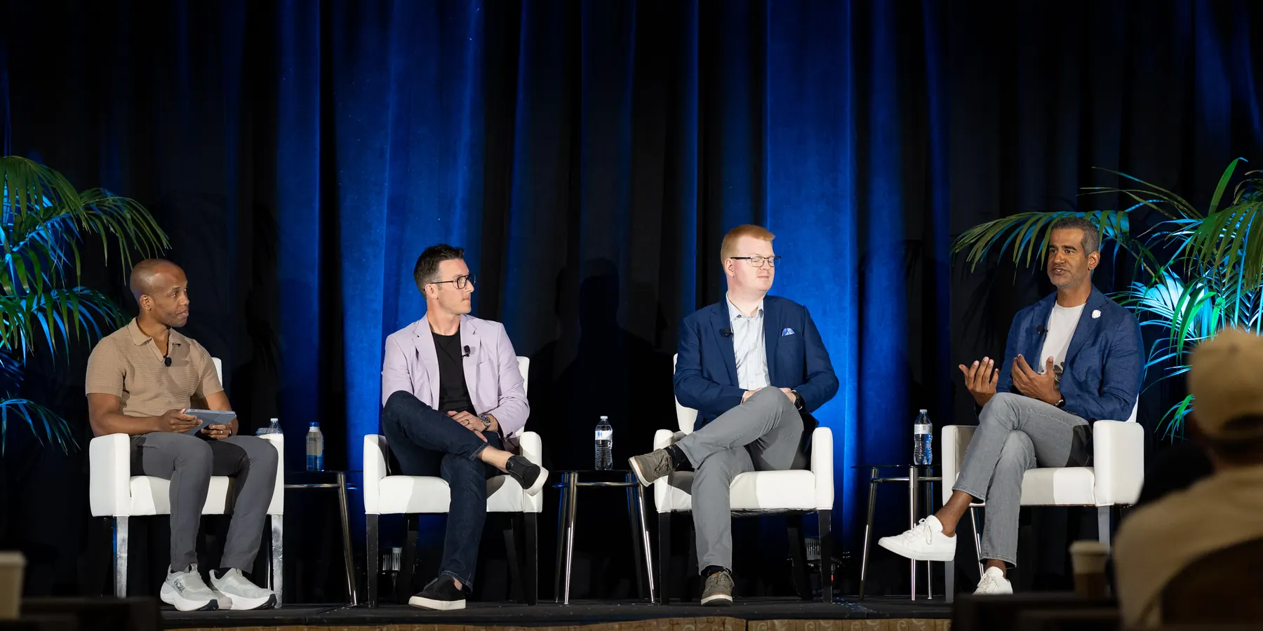 Daniel Paulino, seated at right, speaking on a panel at AIM