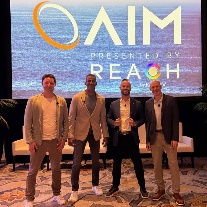 Daniel Paulino with fellow panelists on stage at AIM 2026